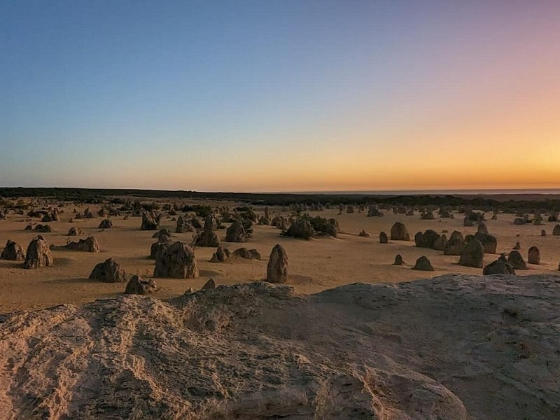 First light reaching the Pinnacles Desert before the heat arrives