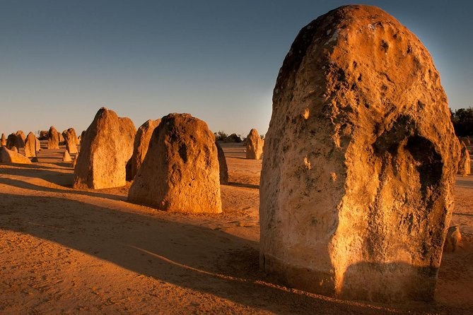 Weathered limestone pillars in low late-afternoon light