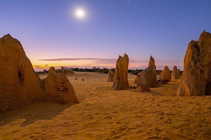 The Pinnacles at dusk with the moon already up over the sand plain